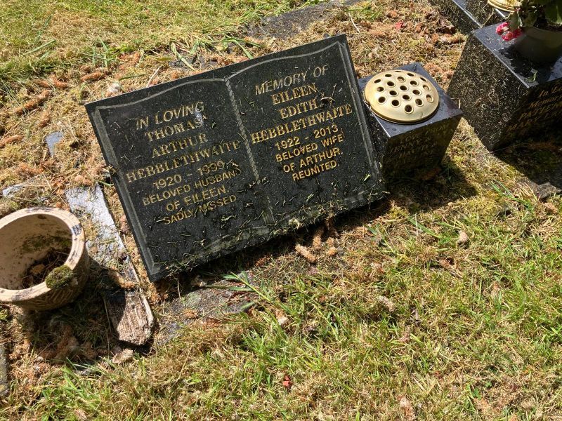Black granite book memorial before cleaning